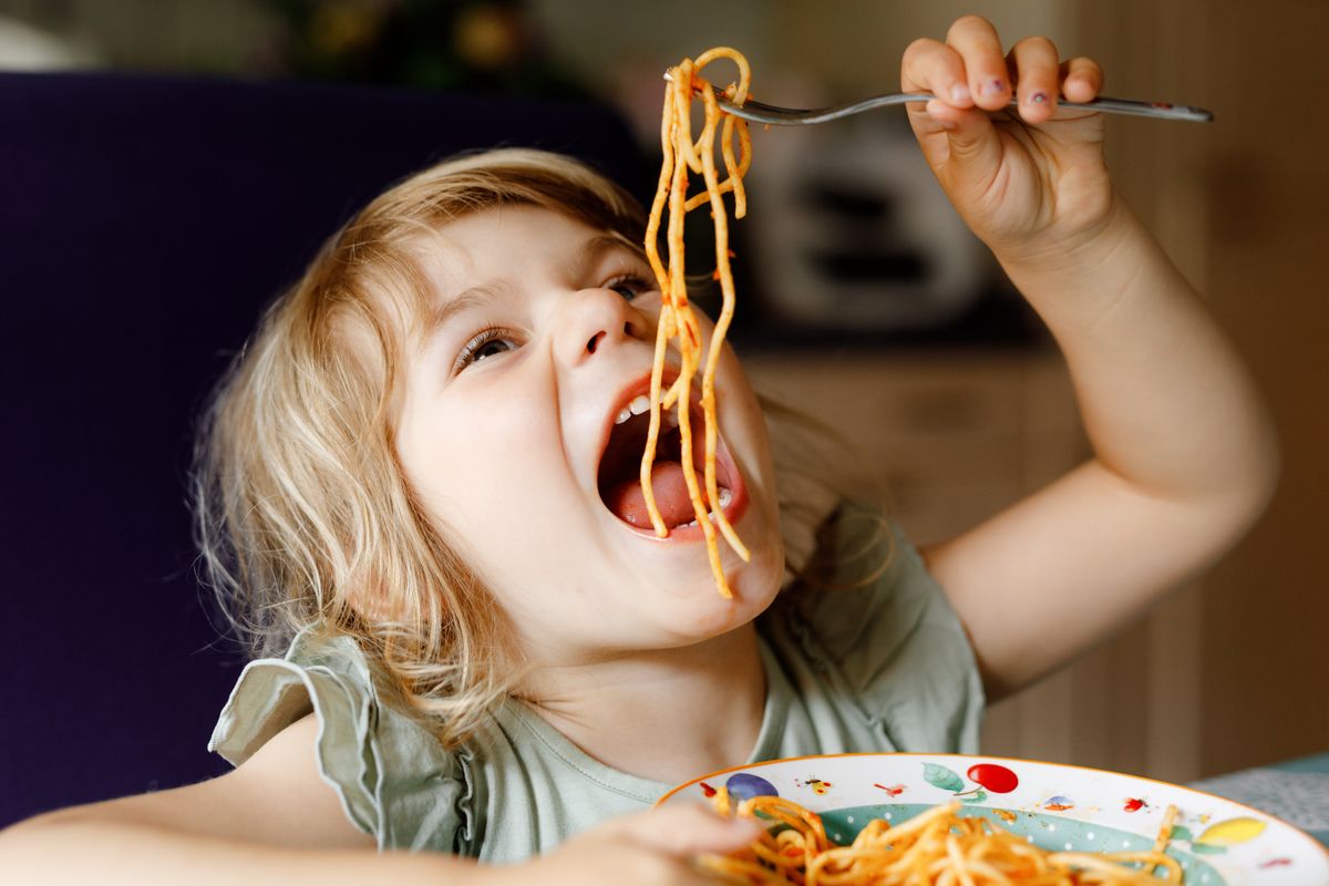 Adorable,Toddler,Girl,Eat,Pasta,Spaghetti,With,Tomato,Bolognese,With