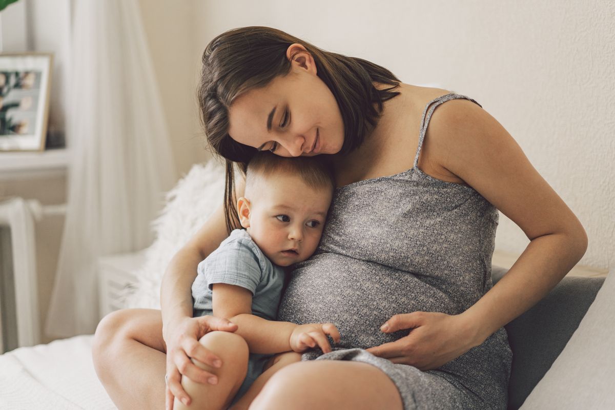 Young,Woman,With,Her,First,Child,During,Second,Pregnancy.,Motherhood anya gyerek, kismama, terhes várandós családi pótlék